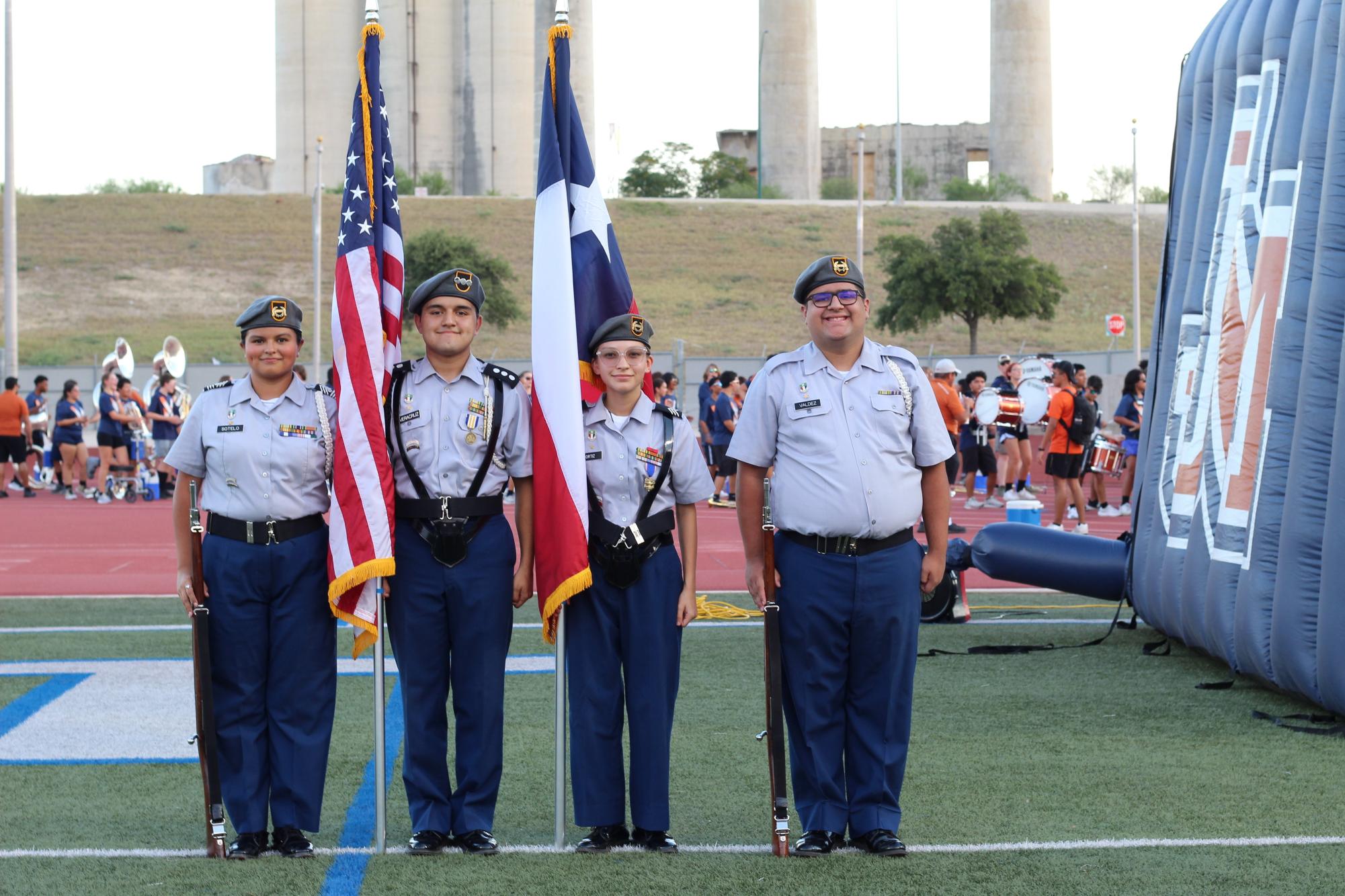 Honoring the colors with cadets! Senior Natalie Sotelo (far left,) Alejandro Veracruz (left,) Fernando Ortiz (Right,) and Jason Valdez (far right) proudly walk the country flag during Meet the Mavs.