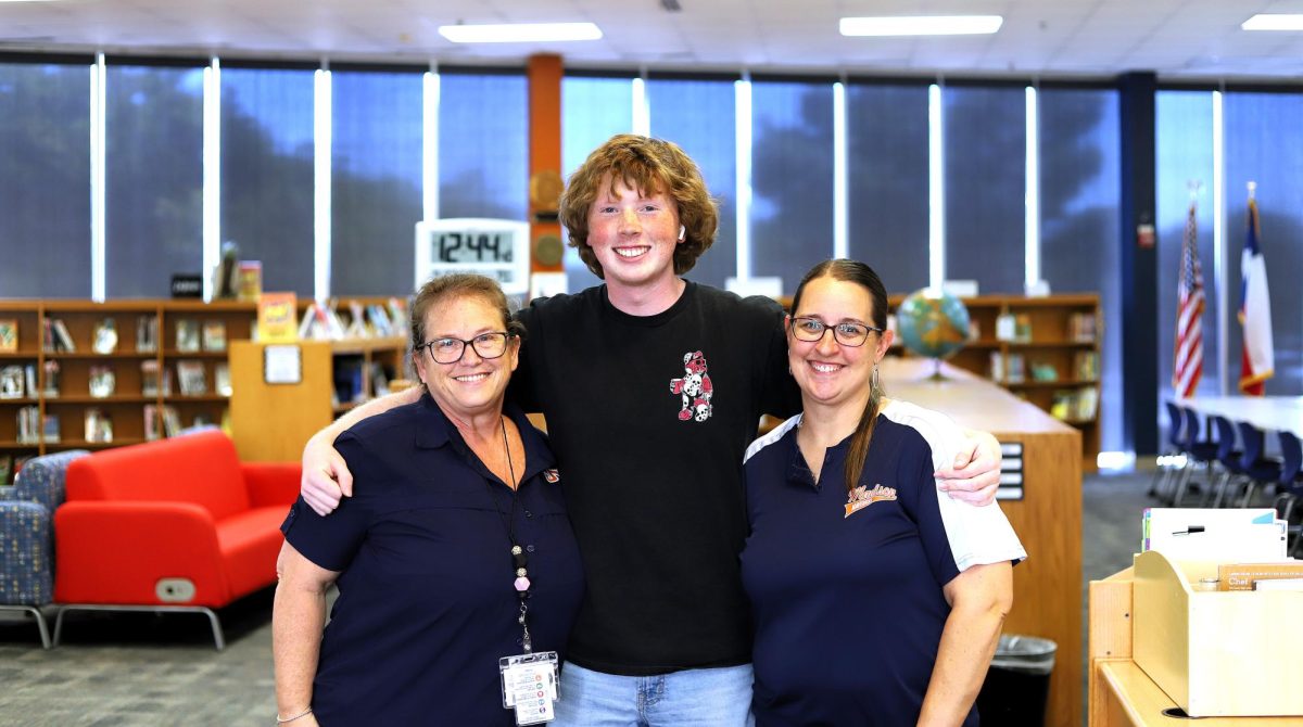 Senior Class President Connor Anda (middle) with co-sponsors Ms. Lenoir, math teacher (left) and Ms. Wright, librarian